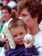 Young boy gets hit with baseball shows it off