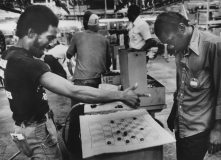 Assembly Line  workers play Checkers