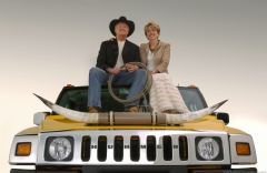 Gary Cowger and his wife Kay sit on top of a Hummer H2