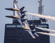 The Blue Angles pass the John Hancock Center on Chicago\'s skyline. 