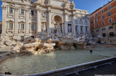 Sweeping coins at the bottom of the Trevi Fountain